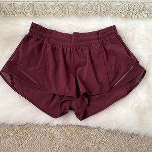 Lulu lemon hotty hot shorts size eight. The color is a maroon deep red color